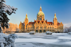 City Hall of Hannover, Germany in winter with snow and frozen lake City Hall of Hannover, Germany in winter with snow and frozen lake